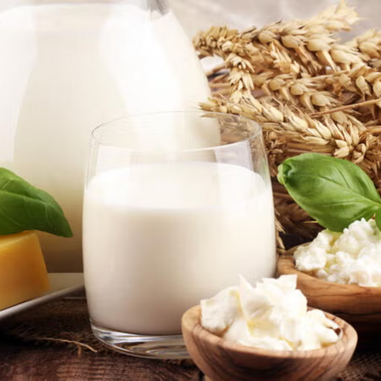 carafes of milk, cheese, and wheat stalks (c) Getty Images